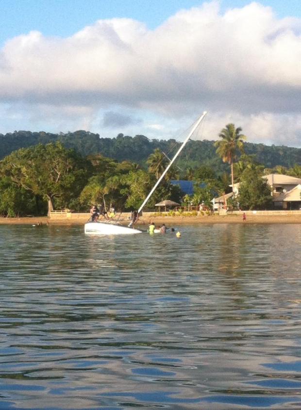 Kids swimming off a local yacht - enjoying the island life.