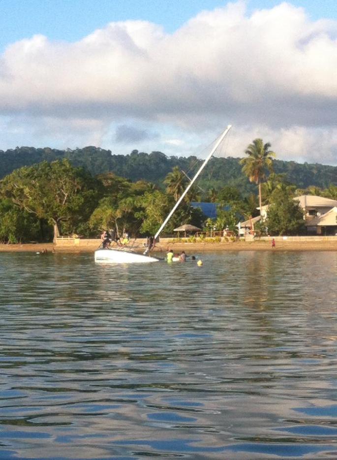 Kids swimming off a local yacht - enjoying the island life.